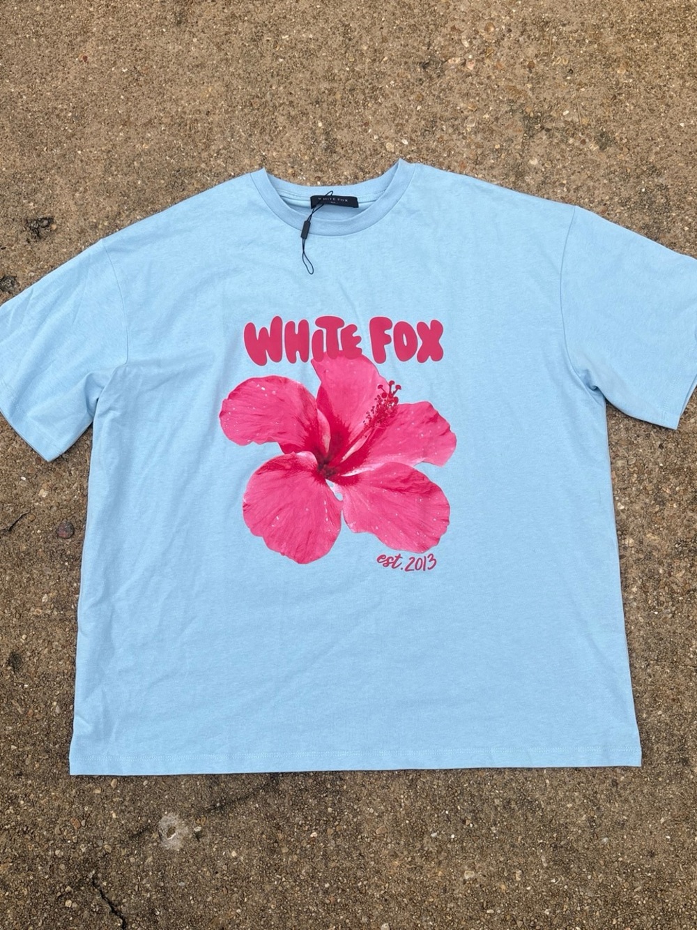 White Fox Boutique Light Blue Tee with Pink Hibiscus Graphic